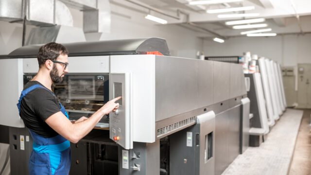 Printing operator working at the manufacturing